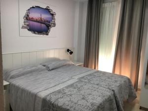 Posteľ alebo postele v izbe v ubytovaní Apartamento Beach