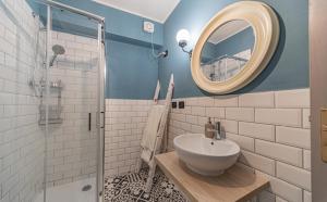a bathroom with a sink and a mirror at Sophia's Loft in Parma +32 photos
