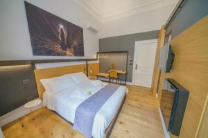 Postel nebo postele na pokoji v ubytování Cafuné Rooms
