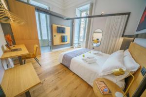 Postel nebo postele na pokoji v ubytování Cafuné Rooms