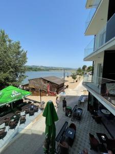 a balcony of a building with a view of the water at Lake View Tašić in Veliko Gradište