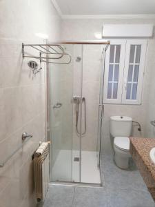 a bathroom with a shower and a toilet at Albergue Cervera de Pisuerga in Cervera de Pisuerga