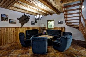 a living room with chairs and a table at Chata Pelikán in Loučná nad Desnou