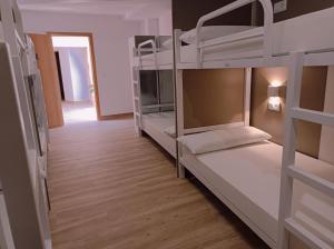 Posteľ alebo postele v izbe v ubytovaní Albergue Hostel Nuestra Señora del Camino
