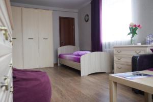 A bed or beds in a room at Gleba Uspenskogo 7A