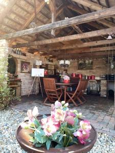 a patio with a table and chairs in a house at K88 Apartman in Siófok