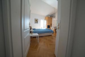 Ένα ή περισσότερα κρεβάτια σε δωμάτιο στο Paradise with Sea View Apartment +70 φωτογραφίες