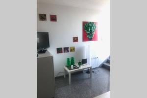 Televízia a/alebo spoločenská miestnosť v ubytovaní Ático con vistas y Gran terraza