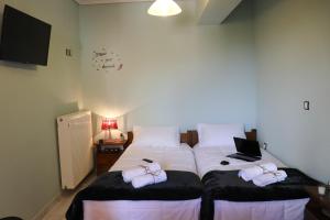 Postel nebo postele na pokoji v ubytování Serenity LX Apartments