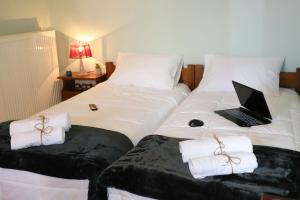 Postel nebo postele na pokoji v ubytování Serenity LX Apartments