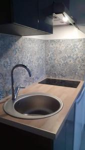 a kitchen counter with a sink in a kitchen at Studio - Marina 4 - 17 allée des Pinons - 2-1 in Saint-Jean-de-Monts