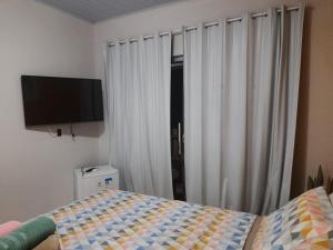 Postelja oz. postelje v sobi nastanitve Pousada Canto Dos Passaros