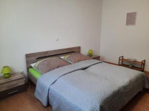 a bedroom with a large bed with a wooden headboard at Bergblick in Golling an der Salzach