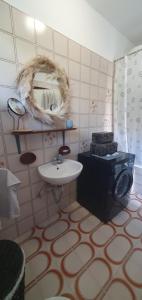 a bathroom with a sink and a mirror at Villa Thalia in Marinići +83 photos