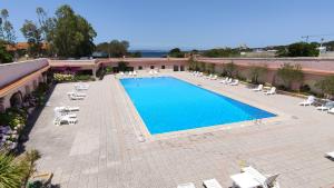 an overhead view of a swimming pool in a resort at Blue Bay Apartment in Cala Bitta