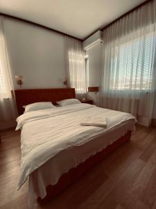 Postel nebo postele na pokoji v ubytování Hotel Ambient - Struga