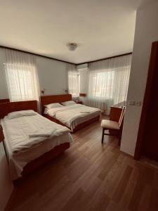 Postel nebo postele na pokoji v ubytování Hotel Ambient - Struga
