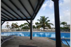 a view of a swimming pool at a resort at LES EAUX BLEUES in Le Gosier