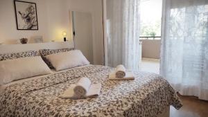 Postel nebo postele na pokoji v ubytování Apartment Leone Umag