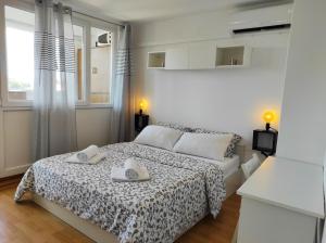 Postel nebo postele na pokoji v ubytování Apartment Leone Umag