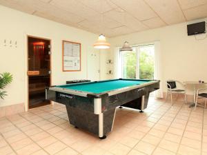 a pool table in the middle of a room at 12 person holiday home in Haderslev in Årøsund