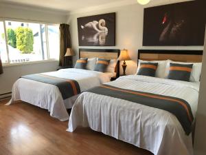 Postelja oz. postelje v sobi nastanitve Duncan Motel