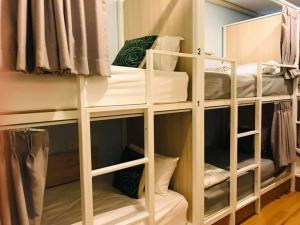 a group of bunk beds in a room at Nature Village Hostel in Lak Si