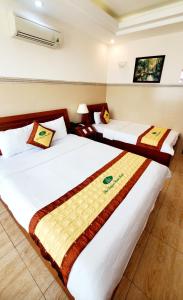 Postel nebo postele na pokoji v ubytování Thanh An Hotel