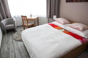 Posteľ alebo postele v izbe v ubytovaní TATRYSTAY Apartmány Lomnica