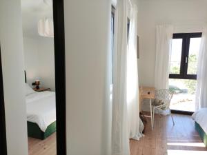 Ένα ή περισσότερα κρεβάτια σε δωμάτιο στο Lazy 8 Villa