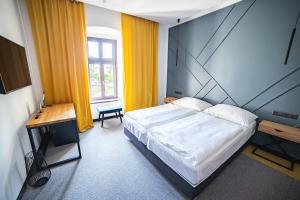 Postel nebo postele na pokoji v ubytování Hotel Gabriella