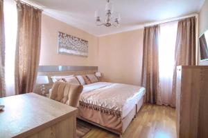 Postelja oz. postelje v sobi nastanitve Benjamin Hotel