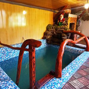 Bazén v ubytování Садиба" У Василя" nebo v jeho okolí