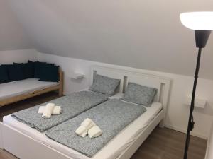 Voodi või voodid majutusasutuse Korall Apartman Fonyód toas