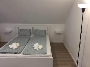 Voodi või voodid majutusasutuse Korall Apartman Fonyód toas