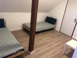 Voodi või voodid majutusasutuse Korall Apartman Fonyód toas