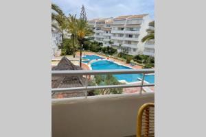 Bazén v ubytovaní Apartamento en Playa Real, en 1ª línea de playa alebo v jeho blízkosti