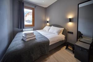 Postel nebo postele na pokoji v ubytování Soldeu Gall de Bosc Luxury Apartment apt Bon aire
