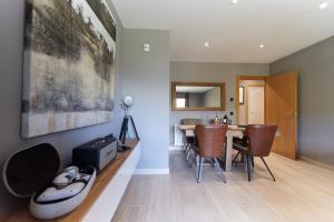 a kitchen and dining room with a table and chairs at Soldeu Gall de Bosc Luxury Apartment apt Bon aire HUT1-7893 in Soldeu