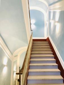 a staircase in a building with a window at Coco's Apartment in Meta