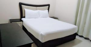 Postel nebo postele na pokoji v ubytování Al Khaleej Plaza Furnished Apartments LLC