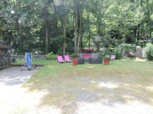 Un jardín fuera de Gîte de l'Ancienne Scierie