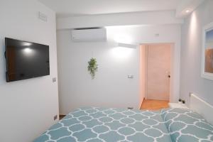 TV a/nebo společenská místnost v ubytování B&B Residenza Aragonese