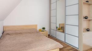 Posteľ alebo postele v izbe v ubytovaní Apartament Zakopiański Relax