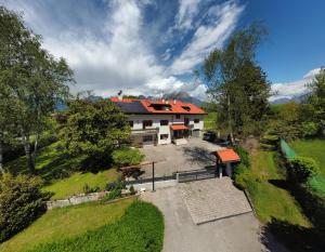 an aerial view of a house with a yard at B&B COL DE LE MOLE - DOLOMITI BELLUNESI in Belluno