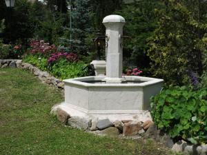 Un jardín fuera de Gîte de l'Ancienne Scierie