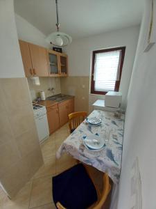 Kuchyň nebo kuchyňský kout v ubytování Apartmani Grzelj-Skledar + 10 fotografií