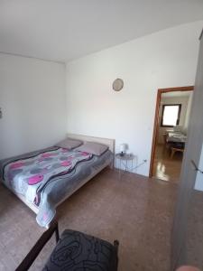 Postel nebo postele na pokoji v ubytování Apartmani Grzelj-Skledar