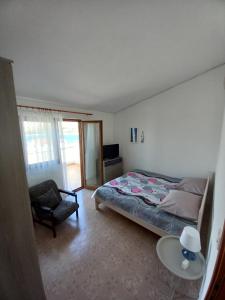 Postel nebo postele na pokoji v ubytování Apartmani Grzelj-Skledar