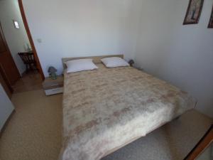 Postel nebo postele na pokoji v ubytování Apartmani Grzelj-Skledar